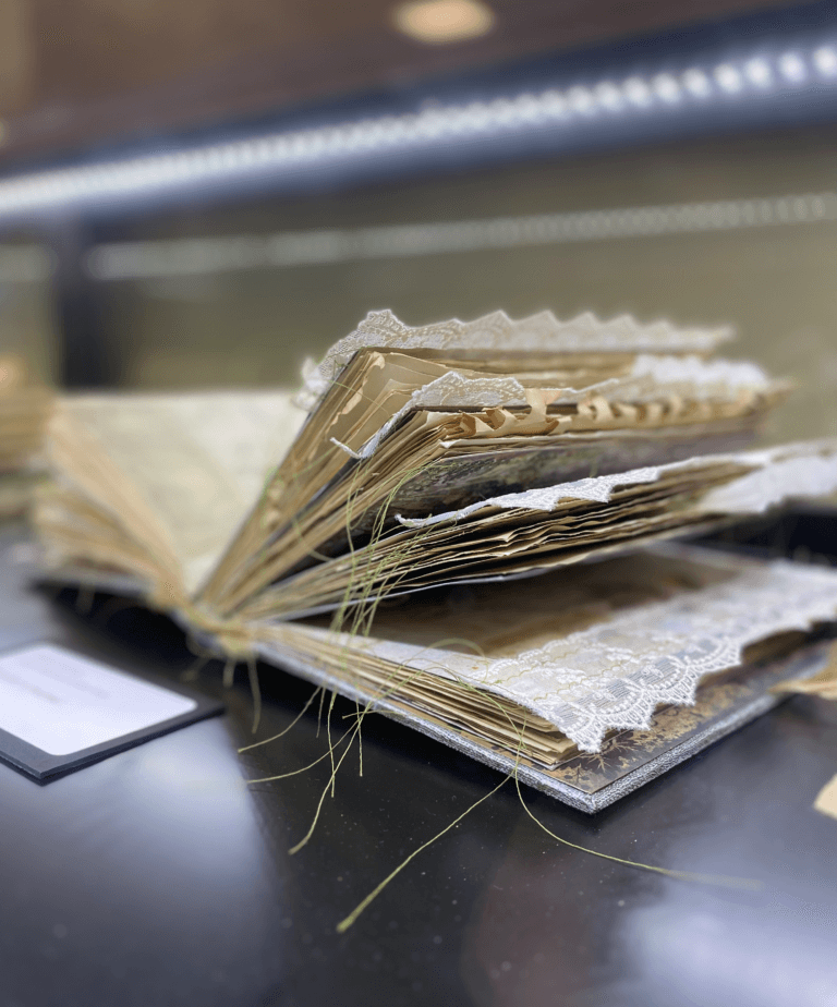 Book with lace sown into the pages.