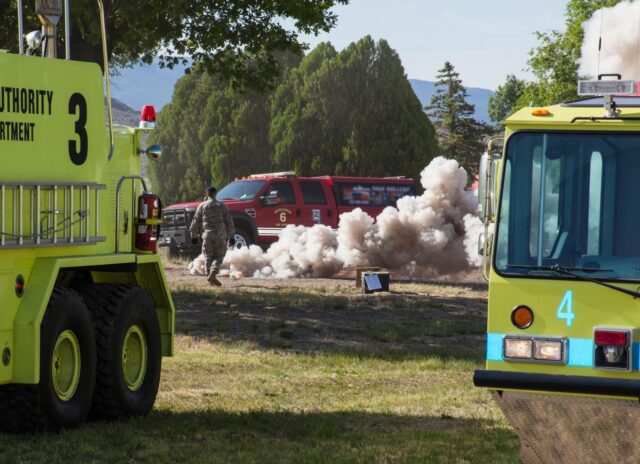 Fire Department vehicles and smoke at RTIA Simulated Mass Casualty Drill.