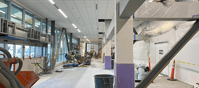 Construction area showing new walking path and windows.