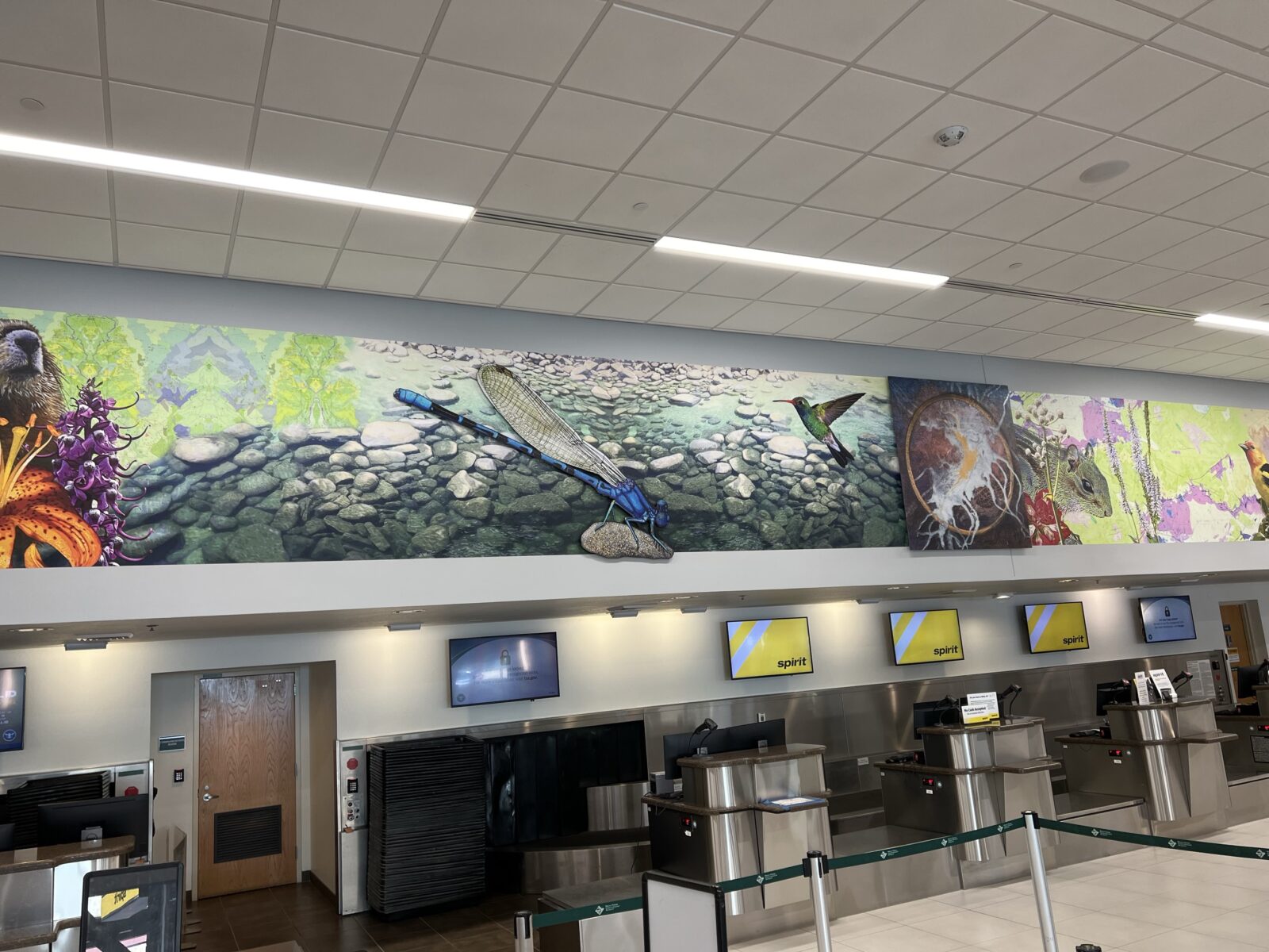 Repeated Refrains art installation. Elements of the photo include birds, insects, plant-life, and more.